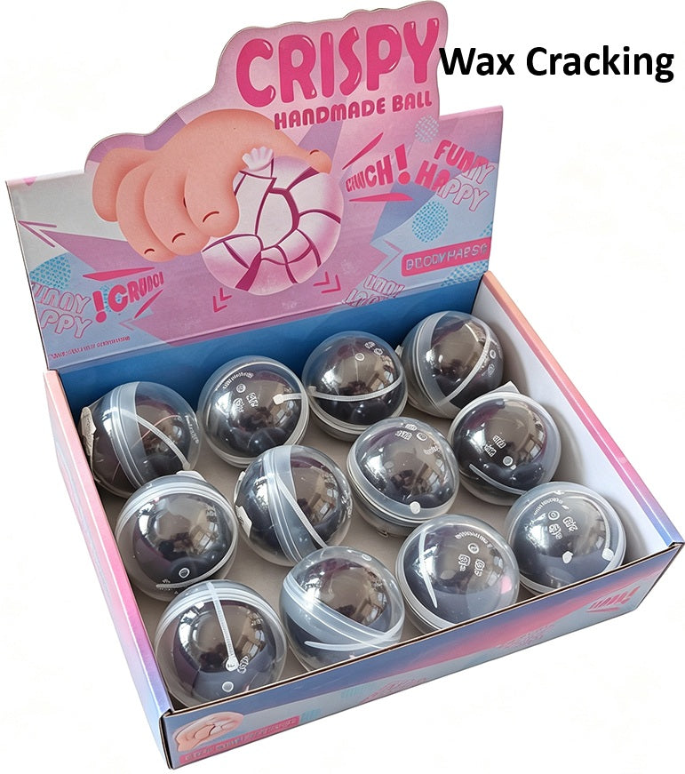 Brown Wax Cracking Ball Squishy, de zachte bal die onder de bruine waslaag zit